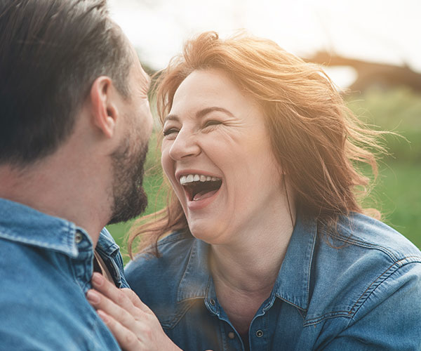happy middle-aged couple laughing